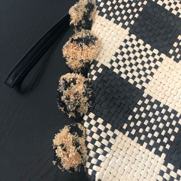 A New Day black & tan woven clutch bag with side pom-poms. - Picture 2 of 4